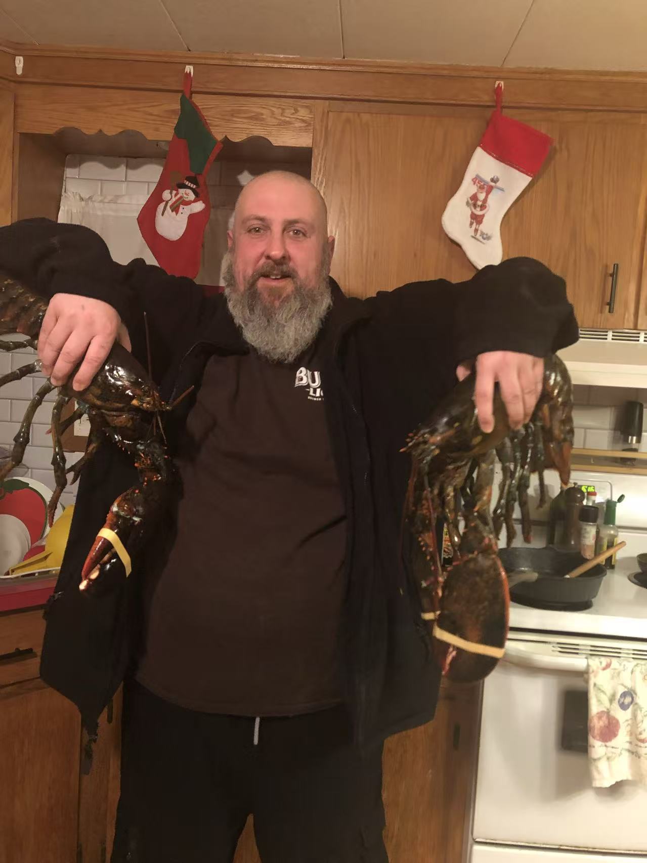 Justin Mullen holding lobsters